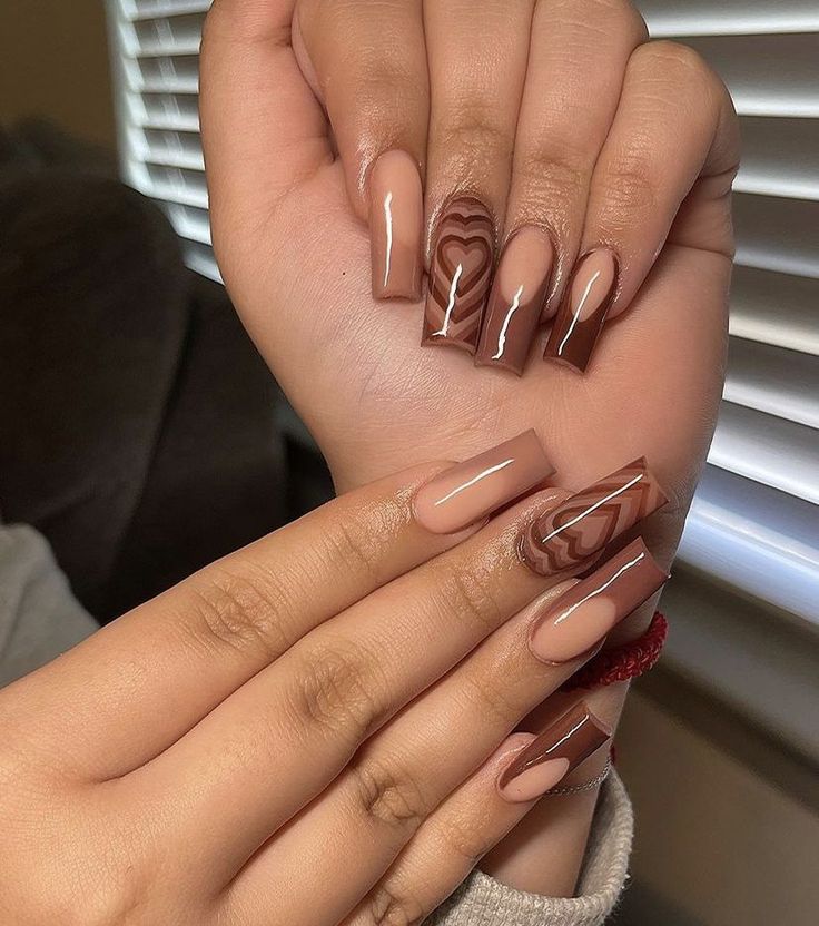 Chic Nude and Brown Marble Nail Design with Heart Accents