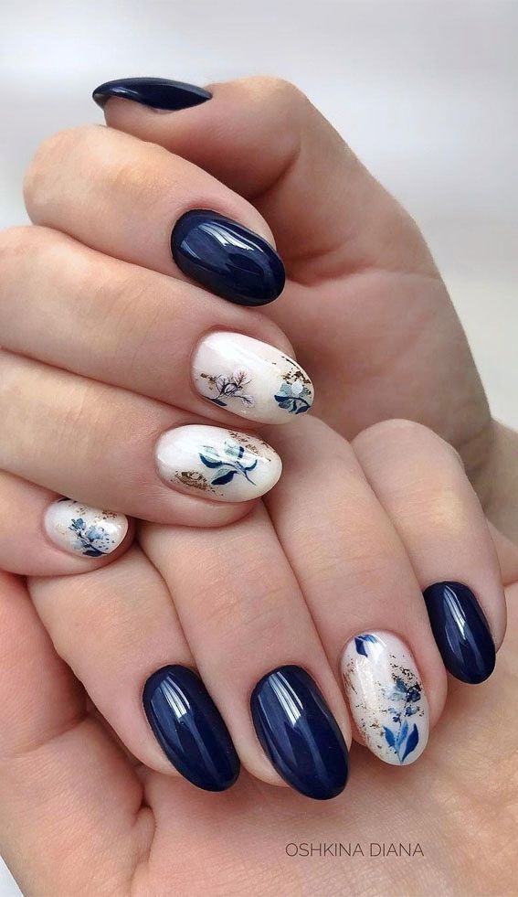 Navy Blue and Floral Nail Design: A Sophisticated Blend of Boldness and Elegance.