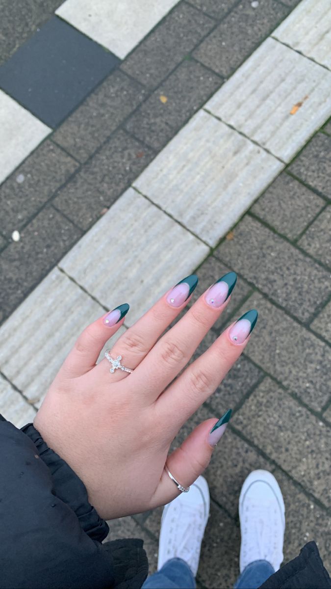 Sophisticated Gradient Nail Design: Soft Pink and Deep Green Tips with Modern Elongation and Delicate Ring Accents.