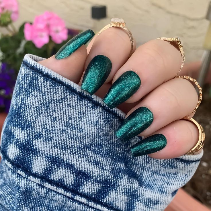 Glamorous Emerald Green Nails: Elegant Design with Glossy Finish and Subtle Shimmer.