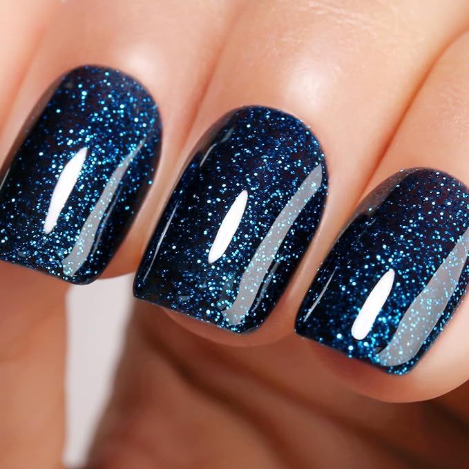 Mesmerizing Glittery Navy Blue Nail Design: Chic Glamour for Any Occasion.