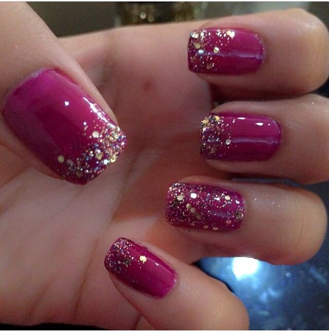 Glamorous Sparkling Ombre Nails with Vibrant Magenta Base and Glittery Gold Tips.