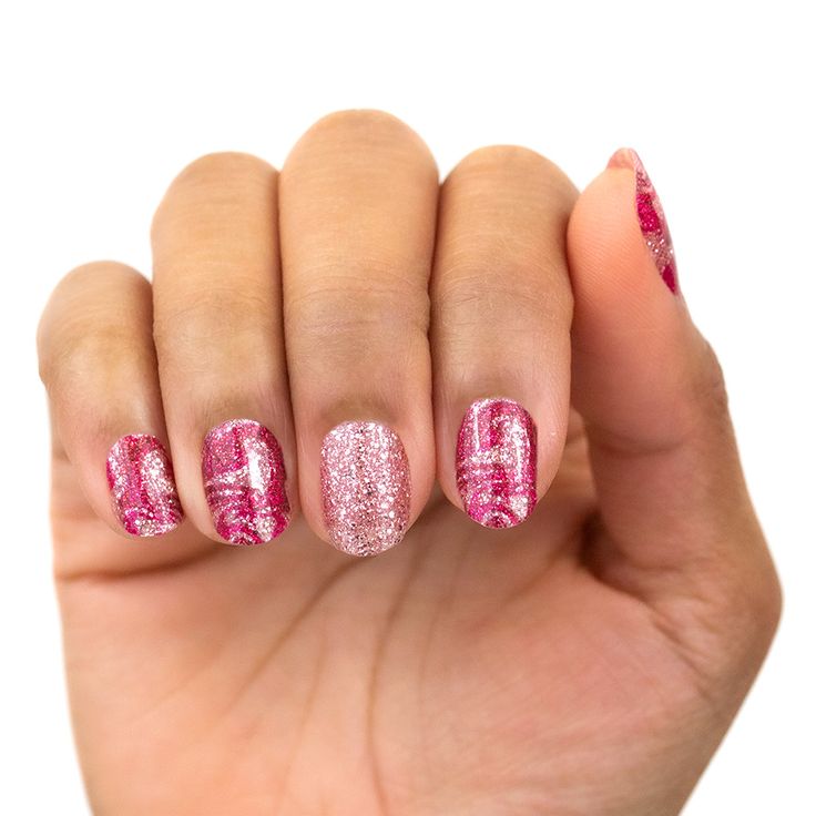 Playful Elegant Glittery Pink Nail Design with Intricate Patterns and Dynamic Textures.