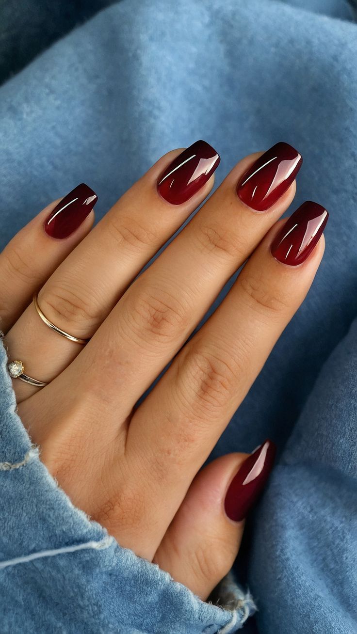 Sleek High-Gloss Burgundy Nail Design for Elegant Versatility.