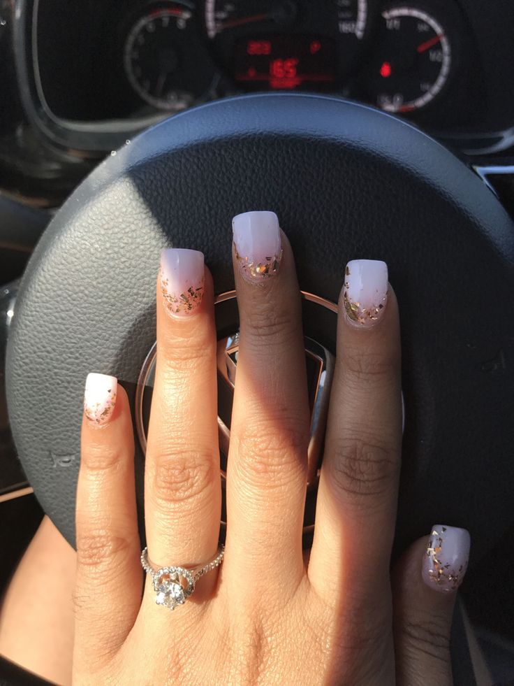 Sophisticated Nail Design: Soft Pink-White Ombre with Glamorous Gold Glitter Accents