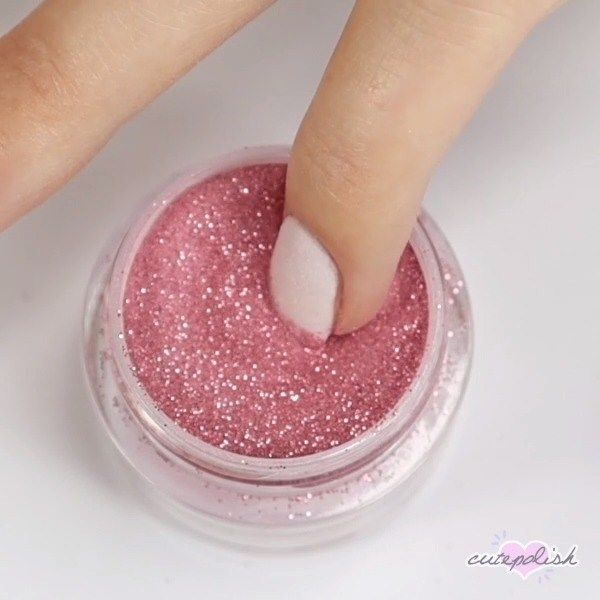 Glamorous Soft Pink Nail Design with Glitter Finish for Any Occasion.