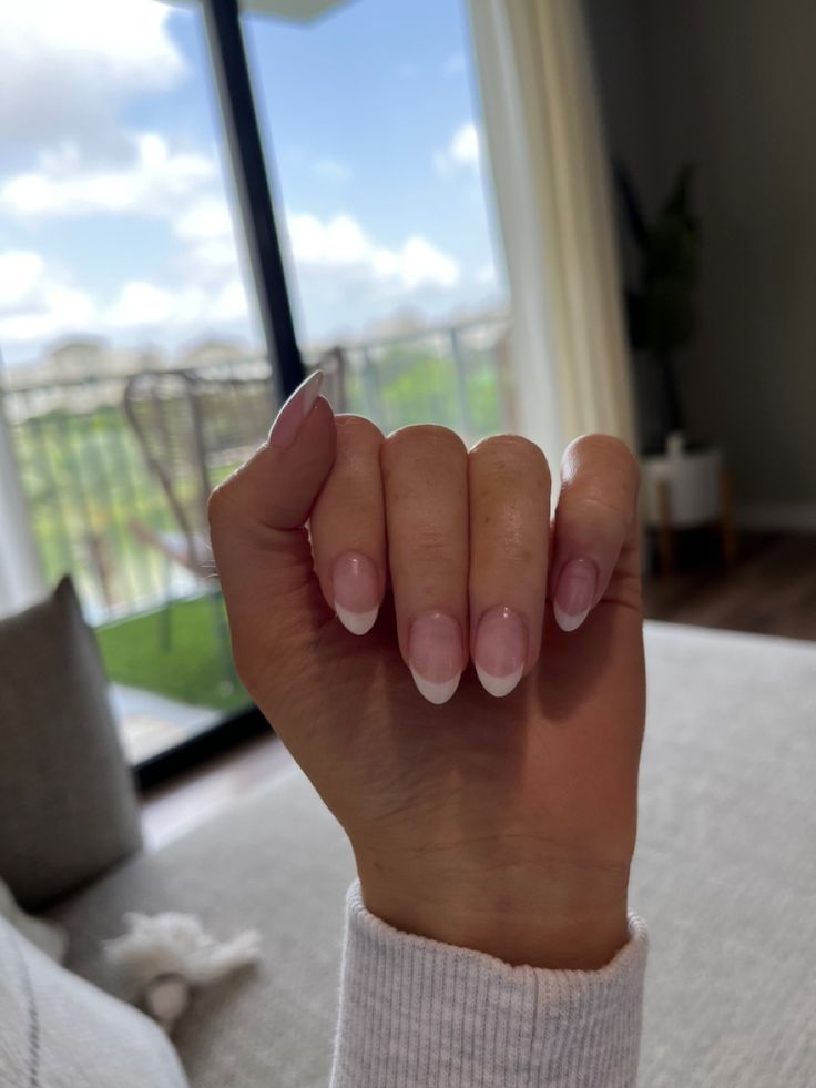 Chic Almond-Shaped French Manicure with Soft Gradient