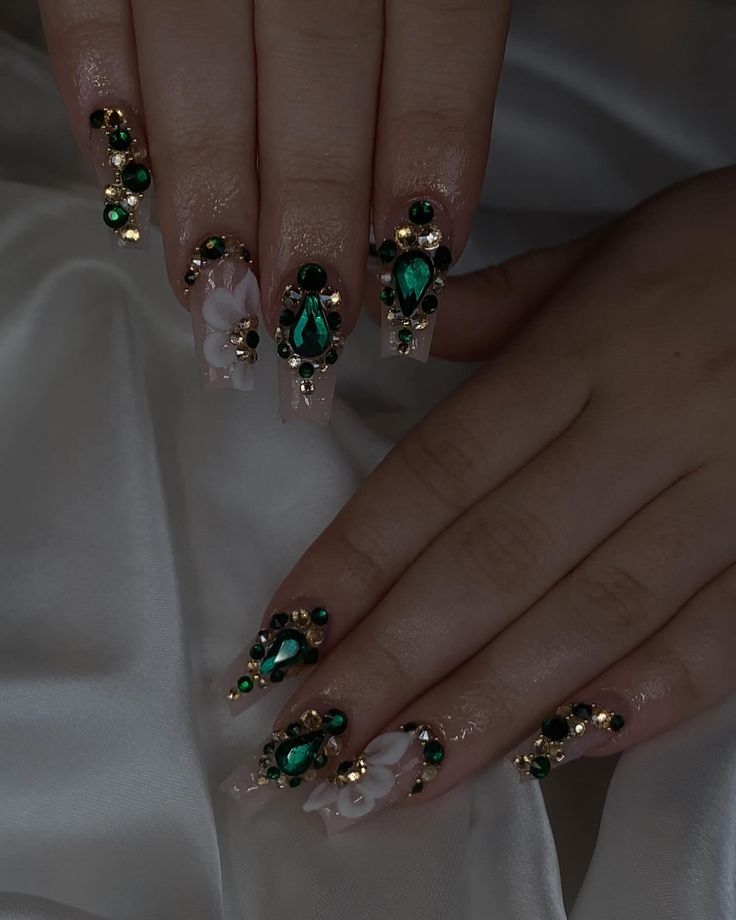 Luxurious Emerald and Gold Glitter Nail Design with Romantic Pink Base