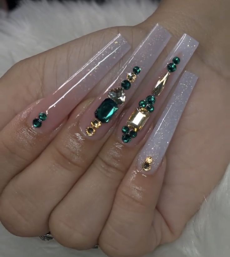 Glamorous Long Nails: Shimmering Pastels with Bold Teal and Gold Accents.