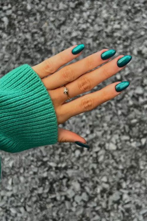 Chic Teal Almond-Shaped Nails: A Stylish Fusion of Artistry and Seasonal Comfort.