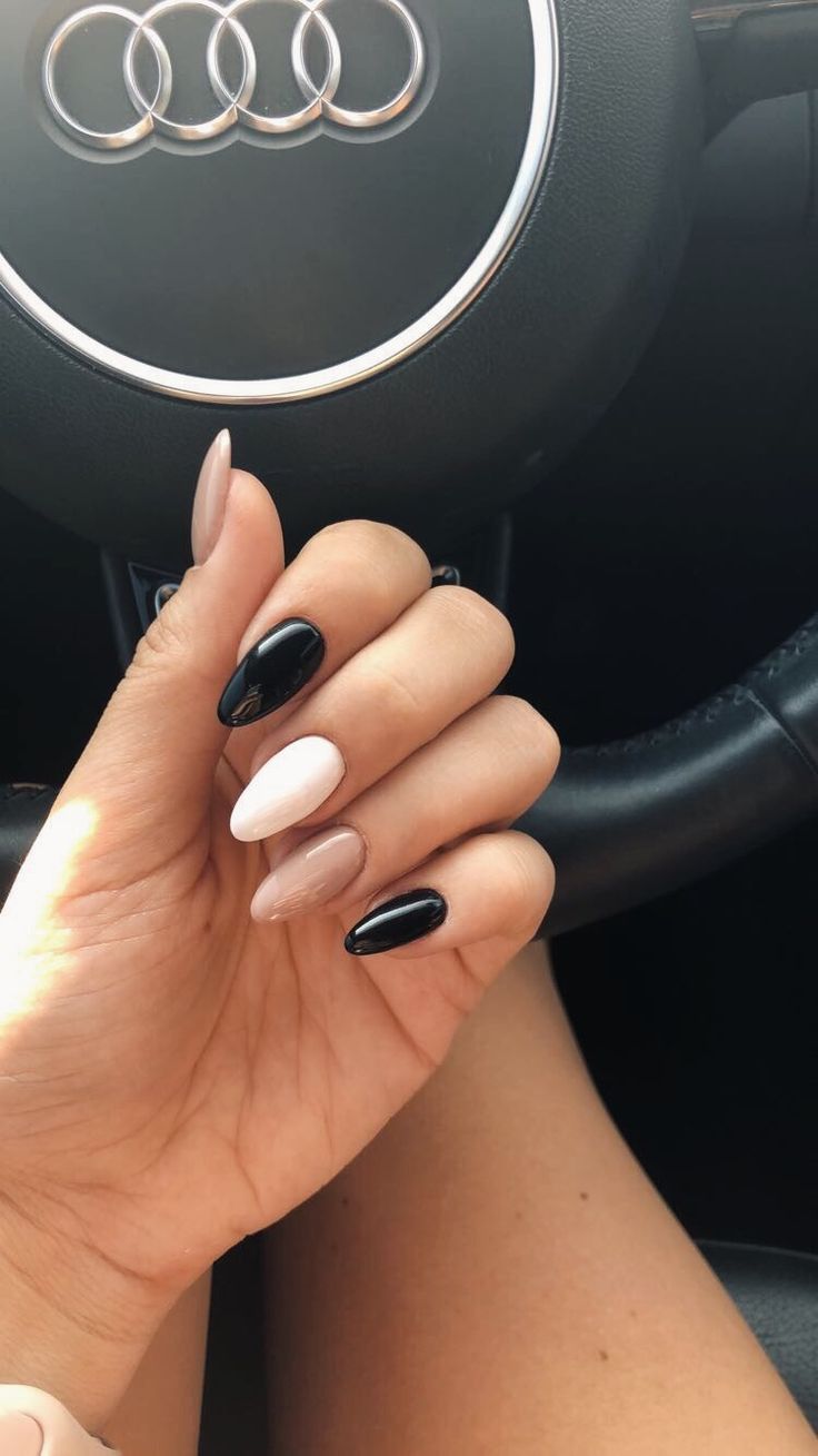 Elegant Manicure: Chic Nude, White, and Black Design with Glossy and Matte Finishes.