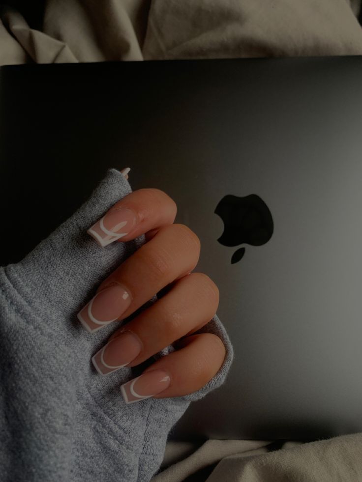 Timeless French Manicure: Chic White Tips on Soft Nude Base for Sophisticated Style.