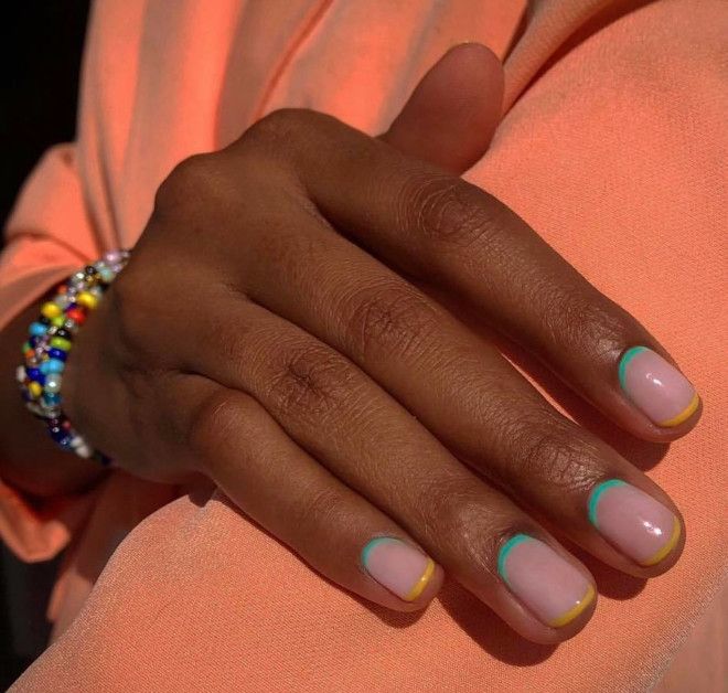 Vibrant Summer Nail Design: Soft Pink Base with Playful Curved Accents in Metallic Teal and Yellow