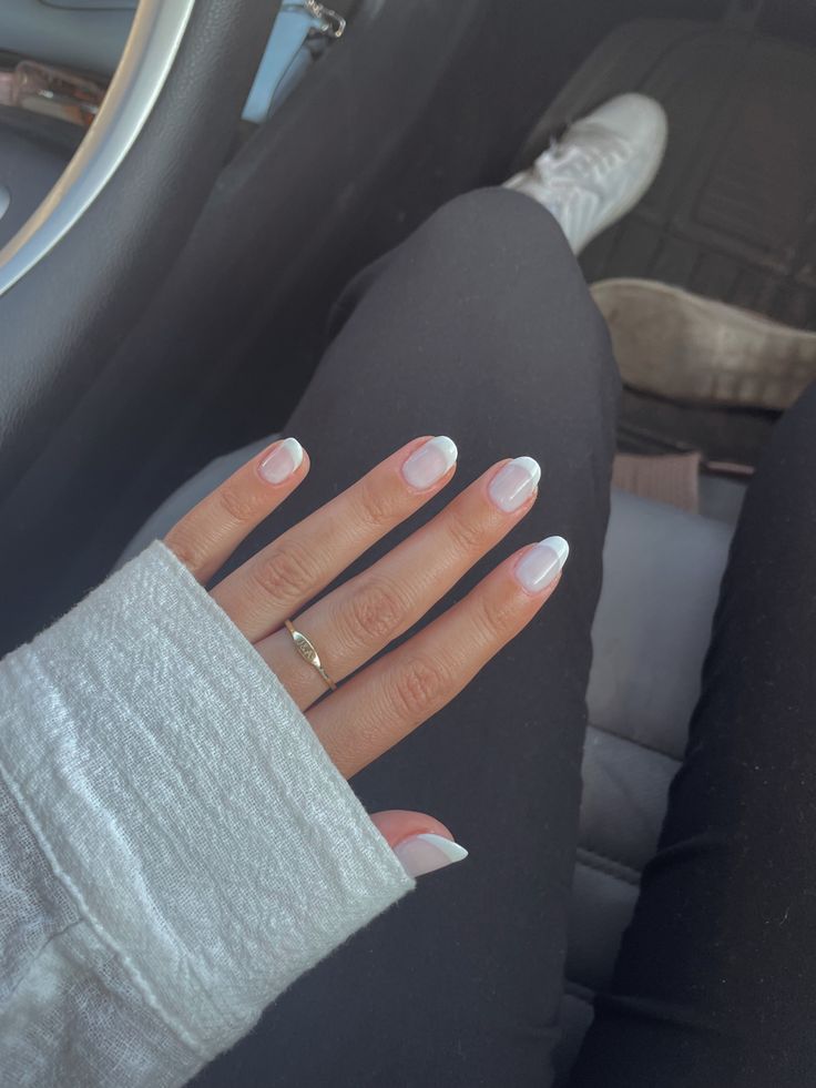 Elegant French Tip Nail Design with Soft Pastel Colors for a Sophisticated Look.