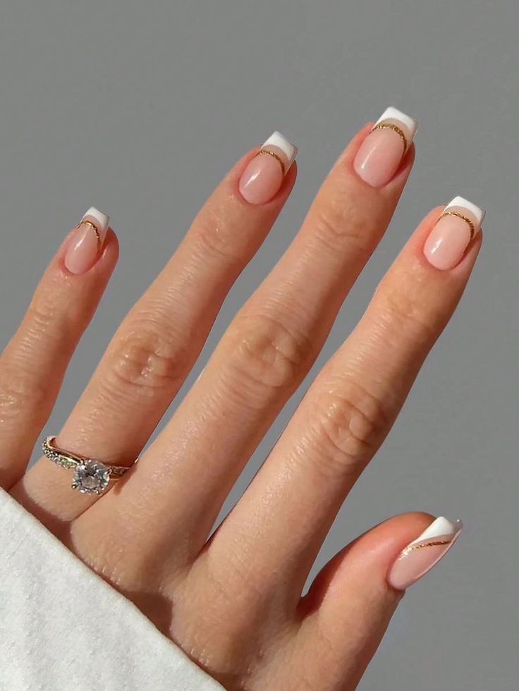 Sophisticated French Manicure: Classic Meets Modern with Gold Accents.