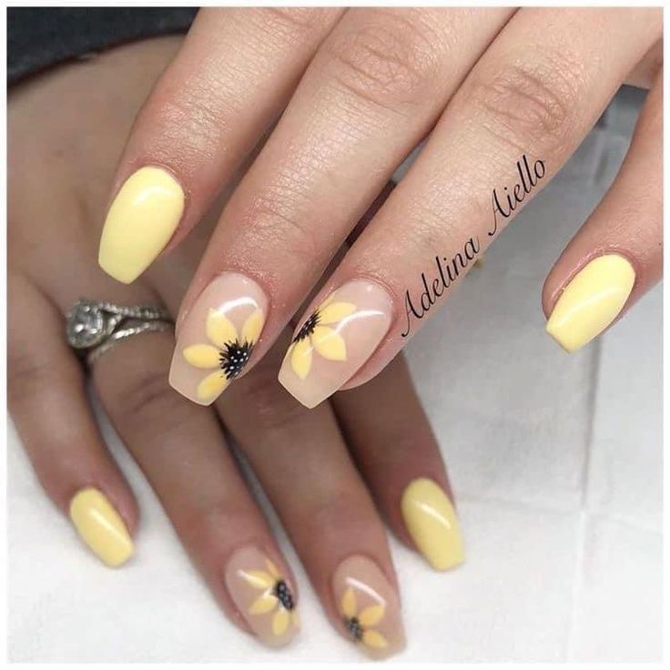 Bright Spring-Inspired Nail Design with Yellow, Nude, and Floral Accents.