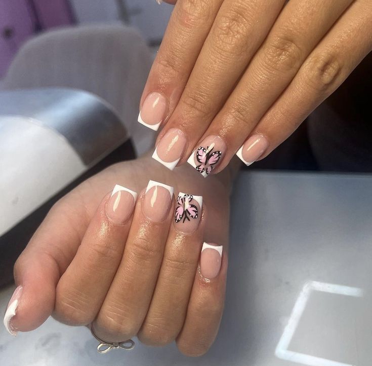 Whimsical Elegance: French Manicure with Butterfly Accent Nail