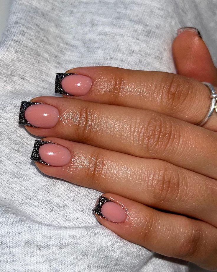 Sophisticated Pink and Bold Black French Tip Nail Design.