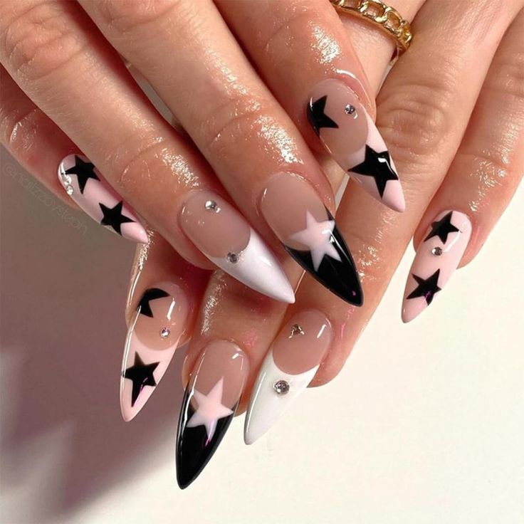 Playful Glamour: Eye-catching Nail Design with Pink, Black, and Star Motifs.