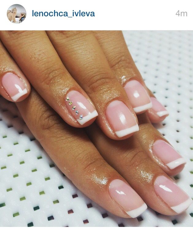 Chic Soft Pink French Tips with Subtle Rhinestone Accents for Any Occasion