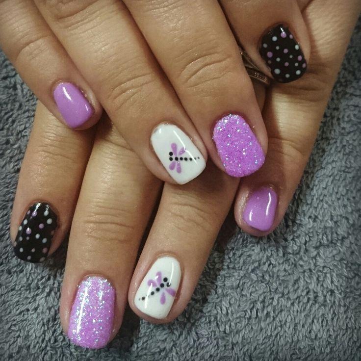 Vibrant Nail Design: Playful Purple, Black, and White with Floral Accents