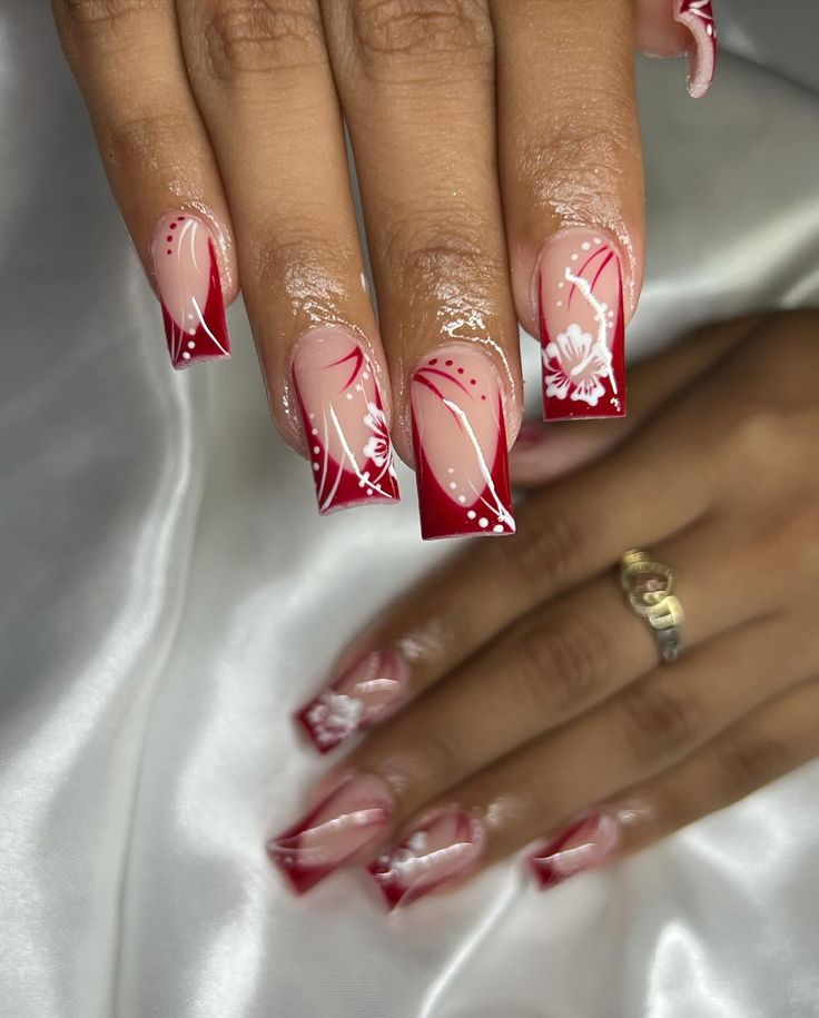 Elegant Red and Nude Floral French Manicure with Modern Contrast.