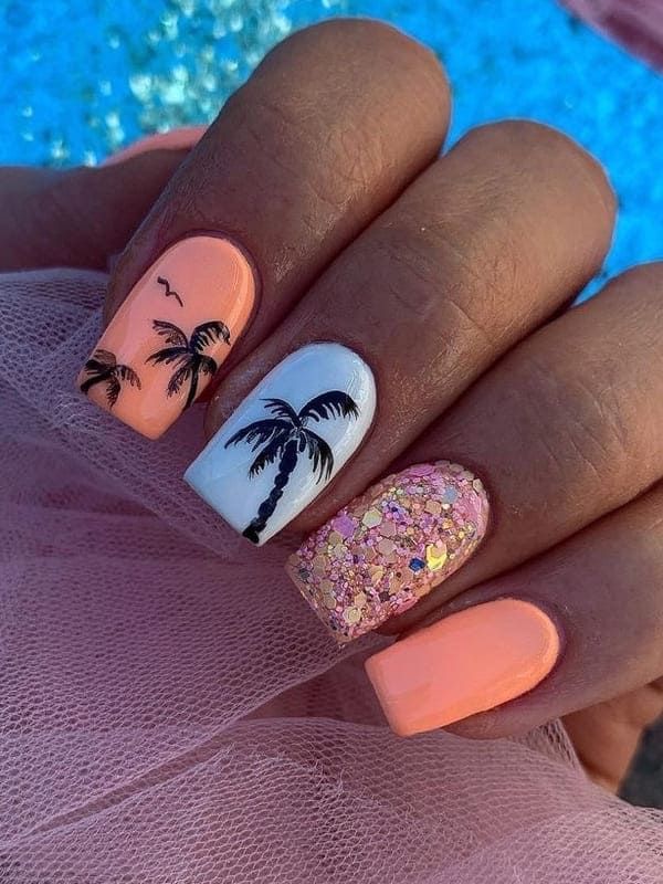 Vibrant Tropical Nail Design: Peach, White, and Glamorous Pink Glitter Accents.