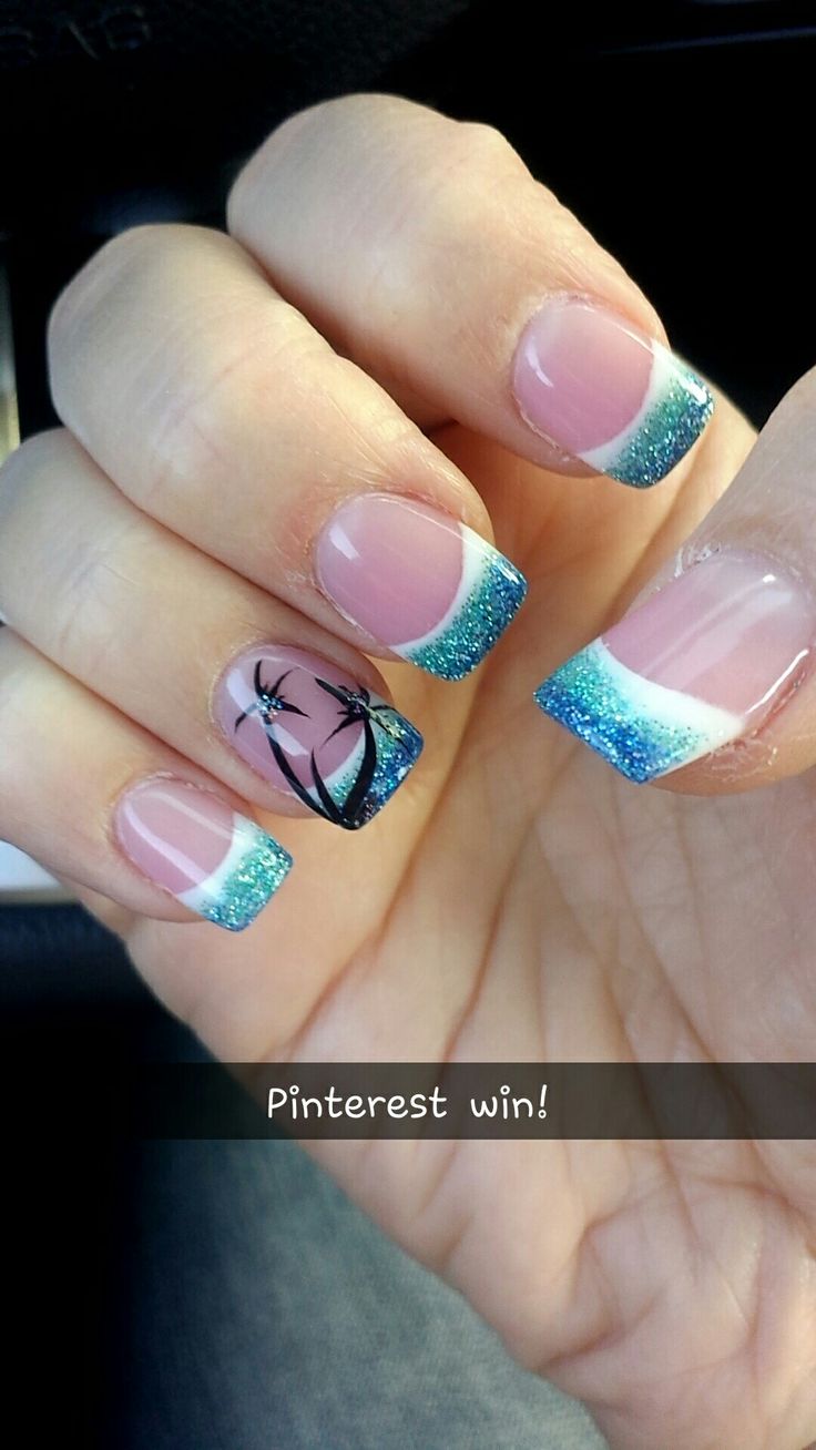 Stylish Gradient French Tip Nails with Teal Glitter and Tropical Palm Tree Accent.