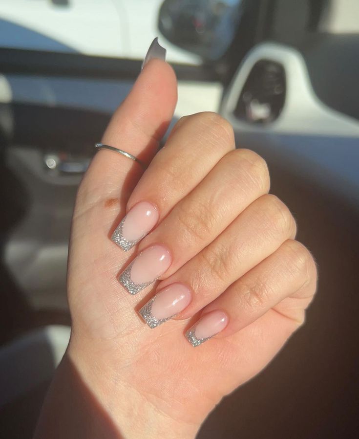 Chic Ombre Nail Design: Soft Pink Base with Subtle Silver Glitter Tips