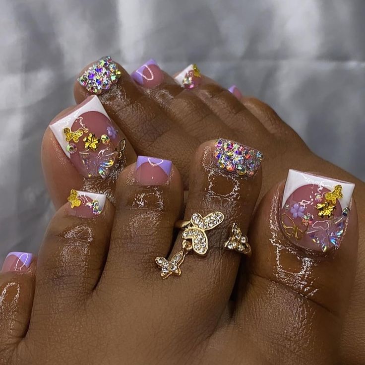 Fresh Pastel Pink and White Nail Design with Glamorous Gold and Floral Accents.