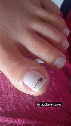 Chic Minimalist Pedicure: Elegant White Base with Subtle Heart Accent