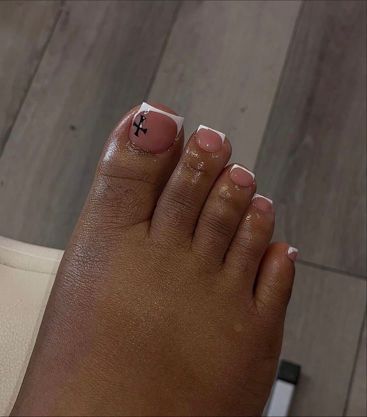 Modern French Pedicure: Subtle Pink Base with White Tips and Black Graphic Accent