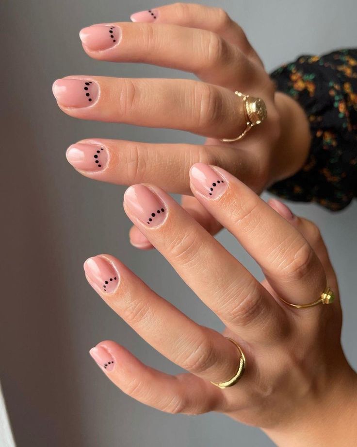 Chic Minimalist Nail Design: Soft Nude Base with Delicate Black Dots