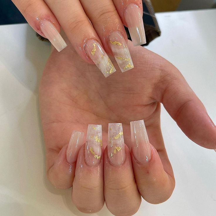 Elegant Long Square Nail Design with Translucent and Milky White Hues and Gold Foil Accents.