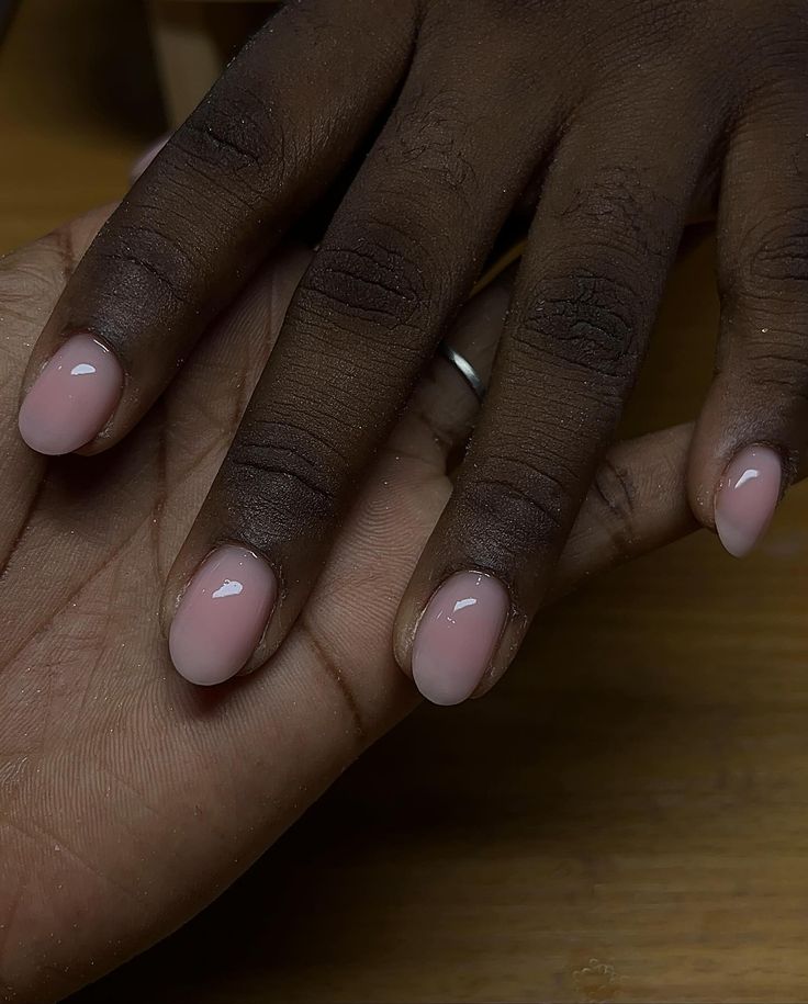 Versatile and Chic Almond-Shaped Nude Nail Design with Subtle Sheen