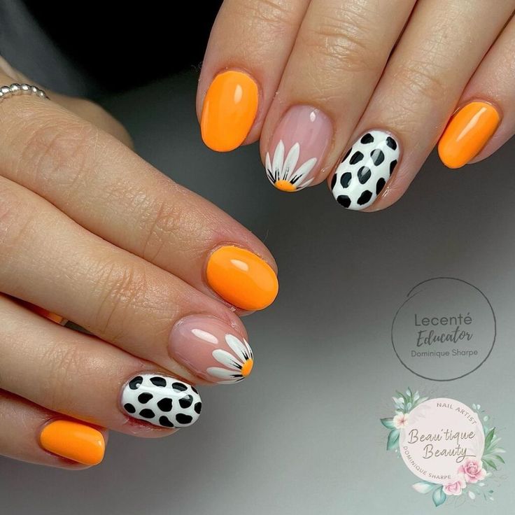 Whimsical Summer Nail Art: Bold Orange and Soft Pink with Floral Designs and Polka Dots.