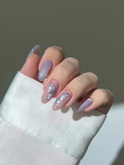 Whimsical Lavender Glitter Nails with Elegant Silver Leaf Accents