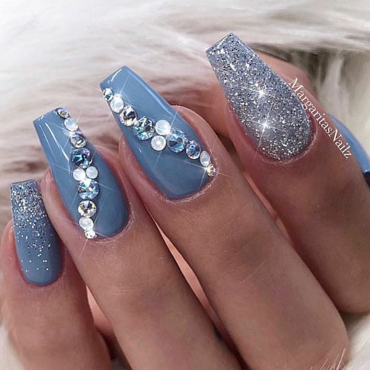 Sophisticated Blue Nail Design with Rhinestones and Glitter Accents