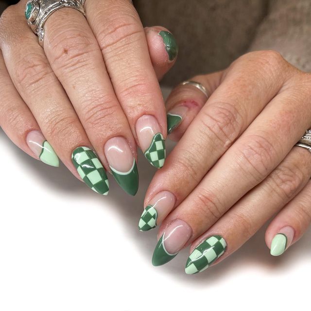 Chic Green Nail Design: Elegant Almond Shapes with Playful Checkerboard Patterns and Contrasting Emerald Tips.