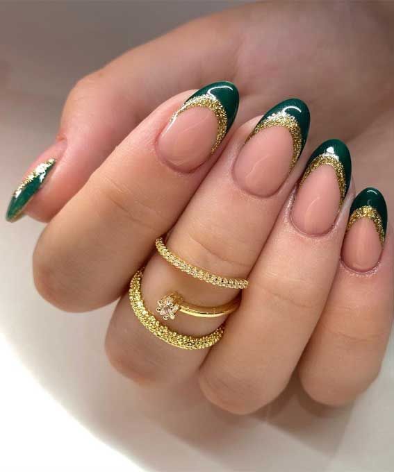 Sophisticated Deep Green and Gold French Manicure with Chic Accents.