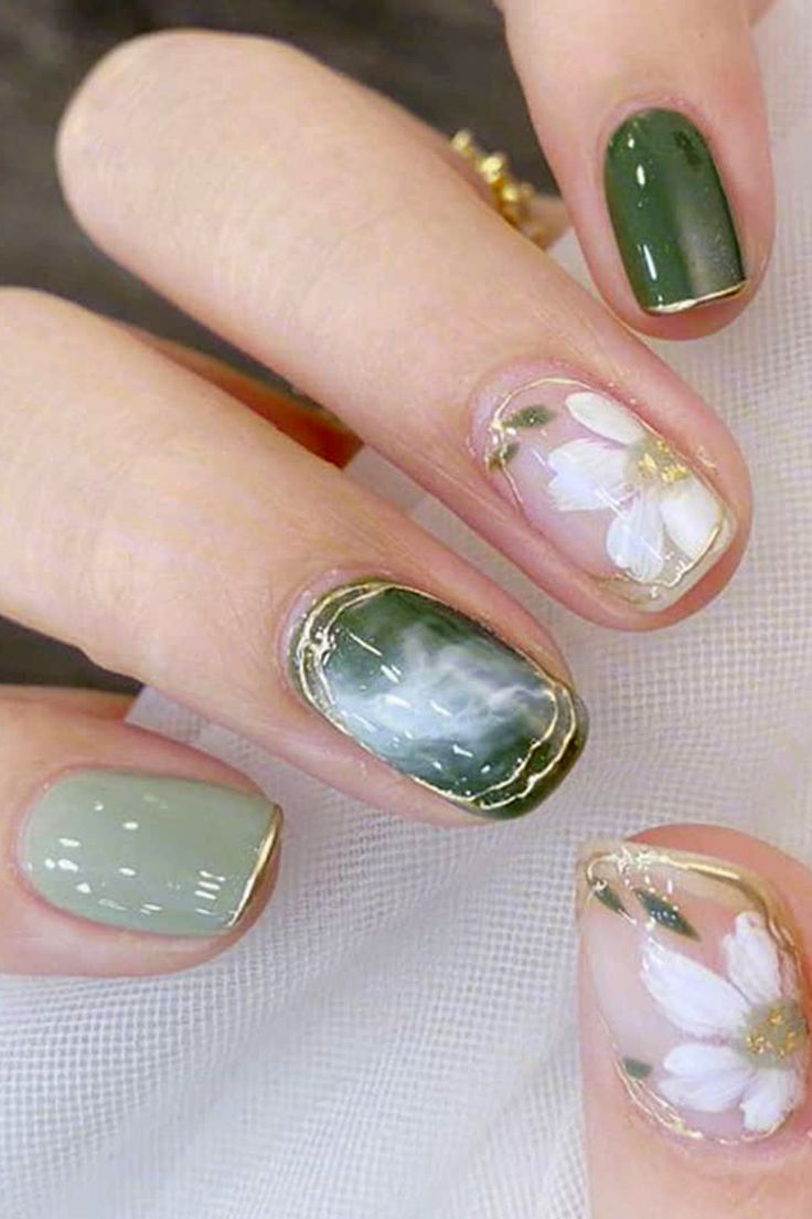 Elegant Soft Green Floral Nail Design with Gold Accents.