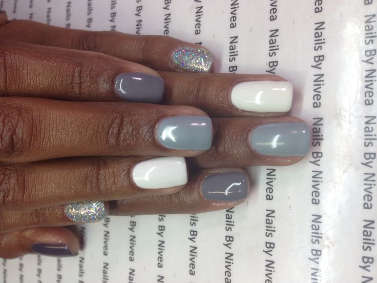 Chic Modern Nail Design with Soft Gray, Crisp White, and Glitter Accents