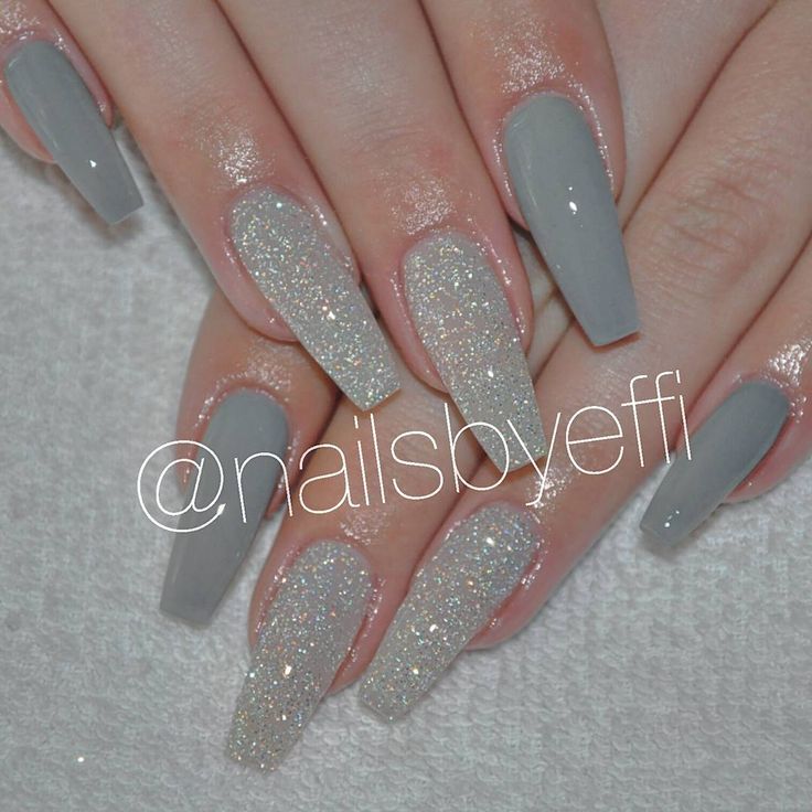 Sophisticated Nail Design: Matte Gray Base with Glittery Silver Accents.