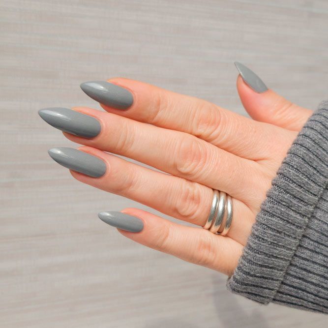 Sophisticated Almond-Shaped Grey Nails with Matte Finish and Minimalist Silver Ring.