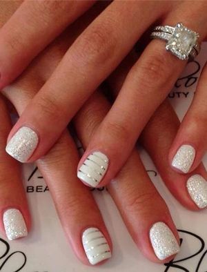 Chic Elegant Nail Design: Sparkling Silver and Smooth White with Striped Accents