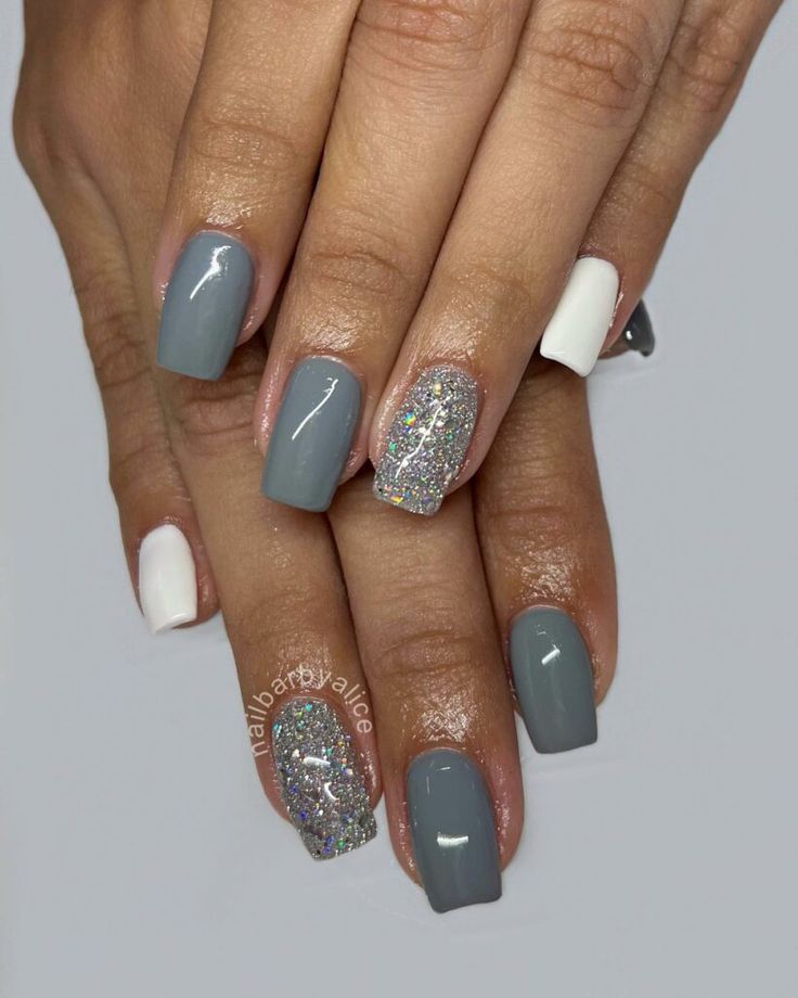 Chic Gray and White Nail Design with Glitter Accent for Any Occasion.