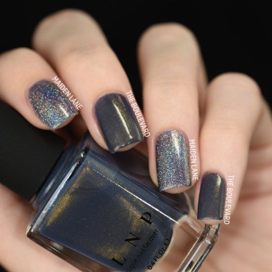 Elegant Navy and Holographic Nail Design for Striking Visual Appeal.