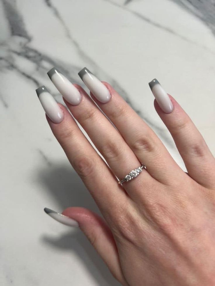 Chic Ombre Nail Design with Long Tapered Shape and Delicate Silver Ring Accents.