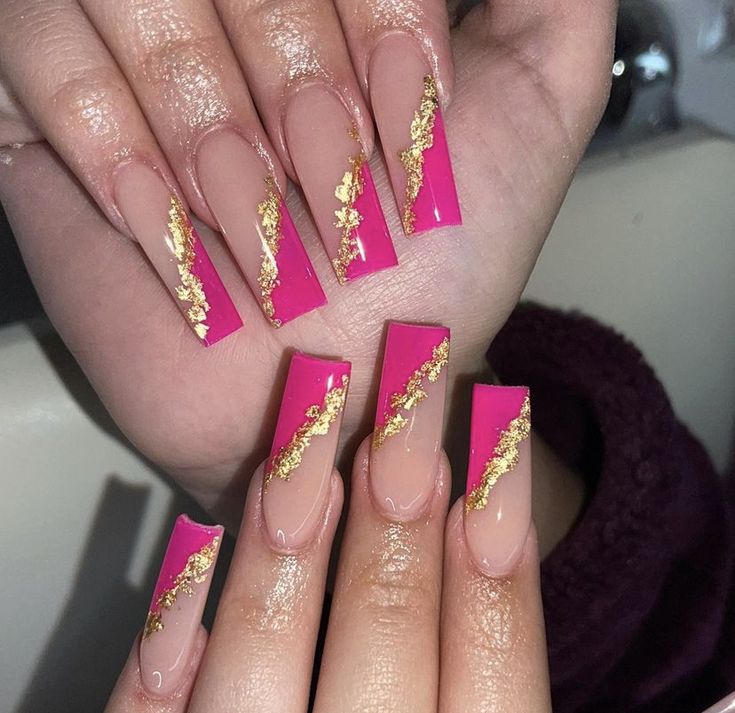 Bold Chic Nail Design: Vibrant Pink and Nude with Elegant Gold Foil Accents.