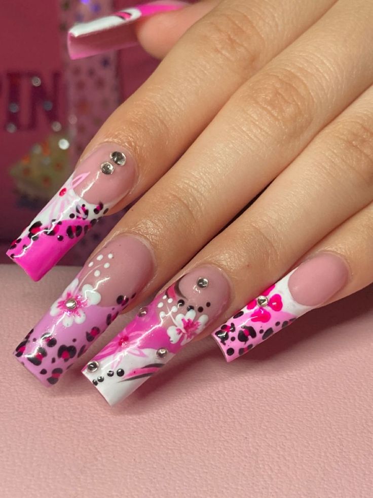 Playful Pink and Pastel Nail Design with Floral and Animal Prints